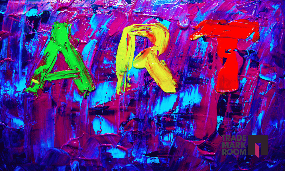 Colourful abstract painting featuring the word "ART" in bold green, yellow, and red letters, with vibrant blue and purple background, and the Trademark Room logo in the bottom right corner.